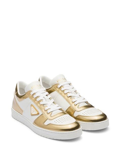 Prada gold low top sneakers